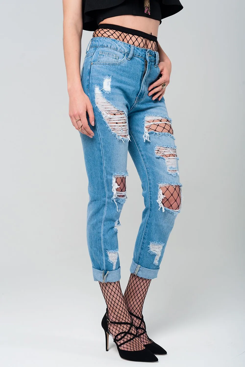 Ripped mom jeans with fishnet tights